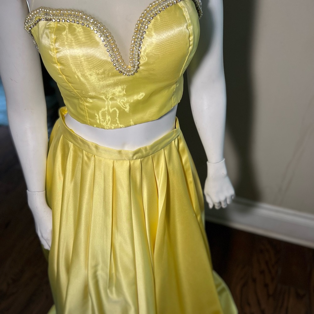 Yellow gown was hand made and Is in good condition just worn ones. Dry cleaned